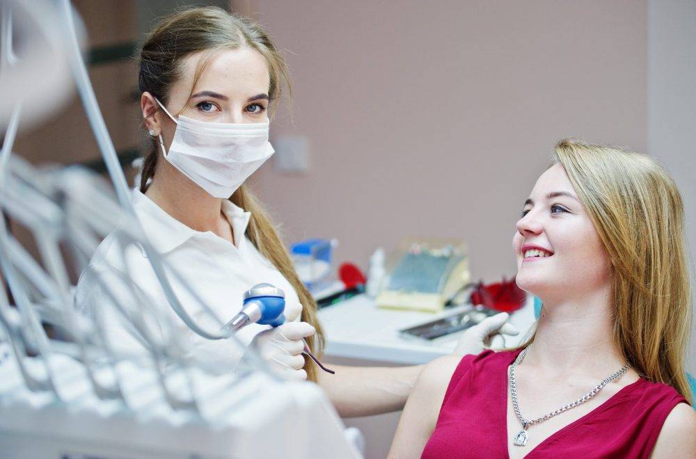 Attractive patient laying on the dental chair