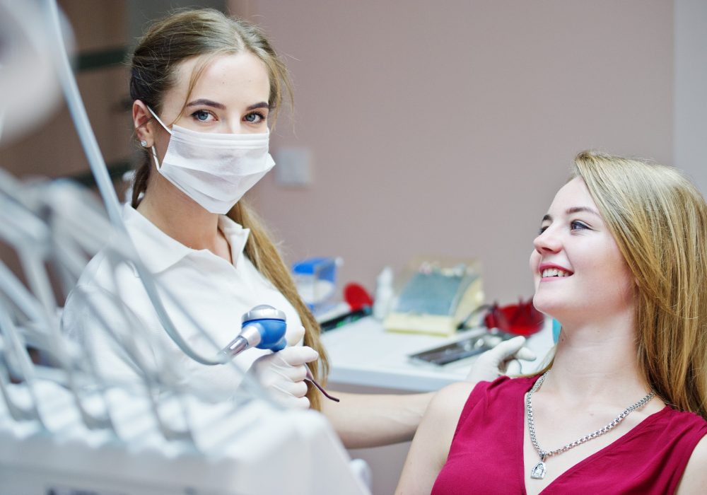 Attractive patient laying on the dental chair