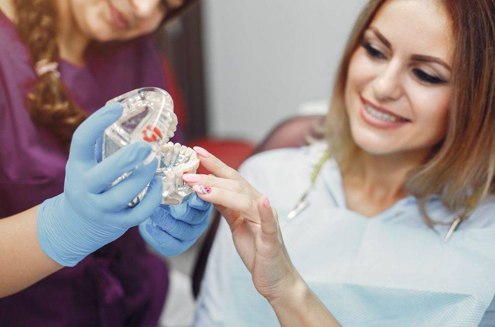 composite Beautiful girl sitting in the dentist's office