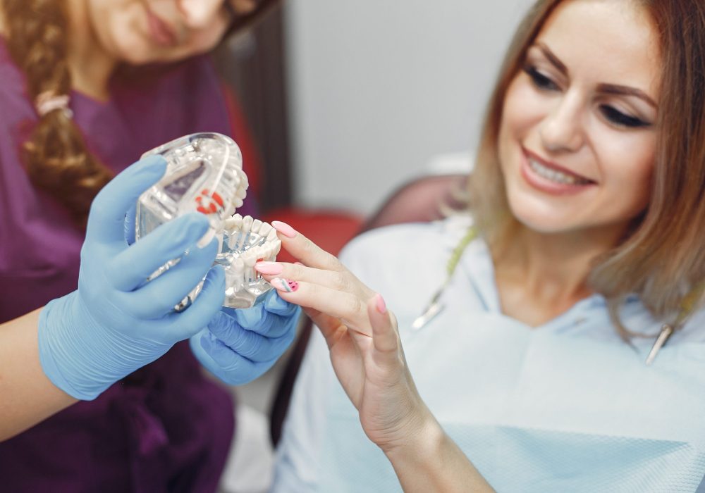 composite Beautiful girl sitting in the dentist's office